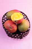 Close-up of mangoes in basket