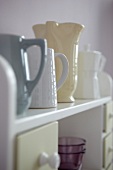 Ceramic crockery on shelf
