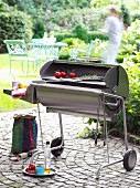 Stainless steel charcoal grill on terrace