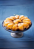Caramelized short crust pastry with pears and butterscotch on serving dish