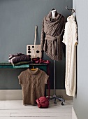 Woollen sweater in basket weave hanging on hook and mannequin