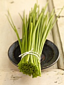 Bunch of chives on saucer