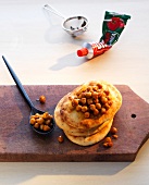 Dry roasted chickpeas with pita bread on wooden board, Indian fast food