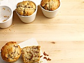 Greek muffins with dates and walnuts in cups and on baking sheet