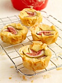 Fig and goat cheese muffins with yufka pastry on cake rack