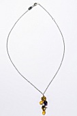 Silver chain with cubic zirconia pendant on white background