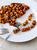 Close-up of caramelized nuts on plate