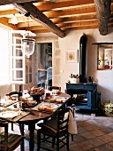 Old kitchen with cooking stove and meal on table