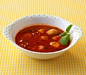Bowl of tomato soup with dumplings