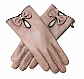 Close-up of beige coloured calf leather gloves on white background