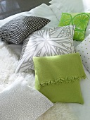 Close-up of grey, green and black patterned pillow