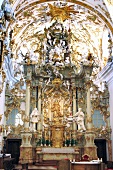 People in Rococo style chapel in Regensburg, Bavaria, Germany