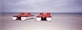 Two red and white paddle boats on beach, Stralsund, Mecklenburg-Vorpommern, Germany