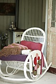 White rocking chair with several blankets