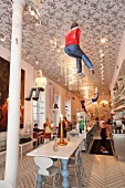 Royal Cafe dolls hanging from ceilings at restaurant, Copenhagen, Denmark