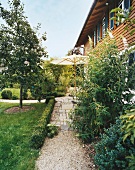 Garden and patio in front of house
