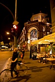 People on street at night in Berlin, Germany, blurred motion