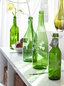 Table decorated with green bottles as vase