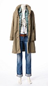 Jacket, green lumberjack shirt and jeans on white background