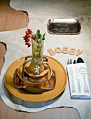 Stacked of plates with rose hips in glass and Russian bread