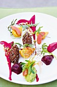 Salad with red quinoa, colourful beets and avocado