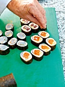 Close-up of adding sea salt to sushi