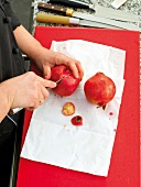 Cutting pomegranate with a knife