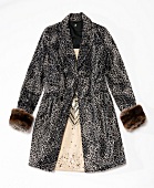 Close-up of leopard print coat on white background
