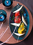 Chilly waves with manchego skewers on blue serving dish