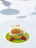 Sole roulade with salmon in filo pastry and oriental couscous on plate