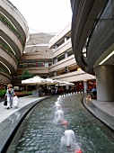 People at futuristic architectured Kanyon shopping mall in Istanbul, Turkey