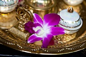 Close-up of golden tray with orchid at luxury hotel in Phuket, Thailand