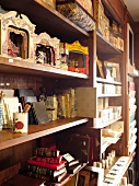 Souvenirs made of paper displayed on wooden shelf at Perugia, Umbria, Italy