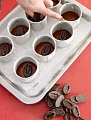 Chocolate pieces on chocolate mixture n cookie cutter