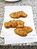 Close-up of fried pork on tissue paper