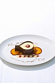 Coffee mousse with pineapple slices on decorated plate