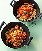 Spaghetti with soya sugo and crunchy noodles with tofu in casseroles