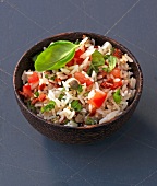 Rice salad with tomato in bowl