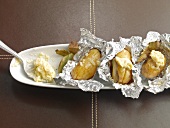 Grilled laurel potatoes and shallot butter in serving dish