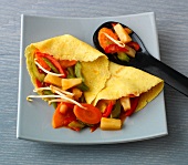 Sesame crepes with sweet and sour vegetables on plate