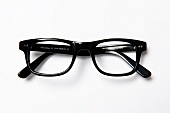 Close-up of black glasses on white background
