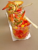 Pepper and tomato salad with coriander prawns in glass jar