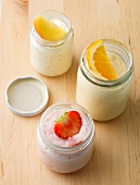 Jars of yogurt with fruits on top