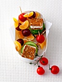 Bread and cheese with fruits in colourful snack box