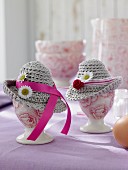 Easter decorations: egg cups decorated with crocheted hats