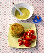 Broccoli millet porridge, patty and tomato salad on plate
