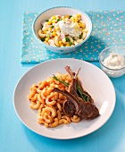 Chilli pasta with lamb chops on plate