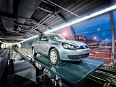 New cars on hydraulic lift at Autostadt, Wolfsburg, Germany