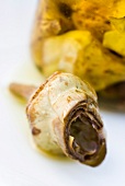 Close-up of artichoke in olive oil