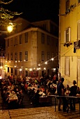 People dining at an open air restaurant, Lisbon, Portugal